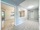 Living room with large picture window to kitchen, tiled floors, and open floor plan at 4887 Seminole Ave, Winter Park, FL 32792