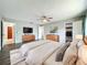 Main bedroom features wood-look floors, a ceiling fan, and walk-in closet at 4887 Seminole Ave, Winter Park, FL 32792