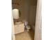 Cozy bathroom featuring tile flooring, modern vanity, and a toilet at 5550 E Michigan St # 2114, Orlando, FL 32822
