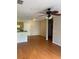 Inviting living room and kitchen combo featuring wood floors and an open layout at 5550 E Michigan St # 2114, Orlando, FL 32822