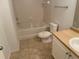 Bathroom featuring a combined shower and tub, toilet, and vanity at 5550 E Michigan St # 2202, Orlando, FL 32822