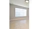 Neutral-toned bedroom offering tile flooring, natural light, and versatile space for personalized decor at 5578 Metrowest Blvd # 10, Orlando, FL 32811