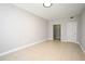 A bedroom showcasing neutral walls, tiled floors, doors leading to the closet at 5578 Metrowest Blvd # 10, Orlando, FL 32811