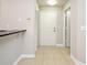 Inviting foyer with neutral tile, white trim and doors, and a convenient breakfast bar area at 5578 Metrowest Blvd # 10, Orlando, FL 32811
