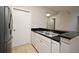 Efficient kitchen space equipped with stainless steel sink, dishwasher, and granite countertops at 5578 Metrowest Blvd # 10, Orlando, FL 32811