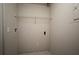 A functional laundry room featuring a wire shelf for storage and convenient electrical outlets at 5578 Metrowest Blvd # 10, Orlando, FL 32811
