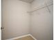 A simple storage room with tile floor and a wire shelf for organizing belongings at 5578 Metrowest Blvd # 10, Orlando, FL 32811