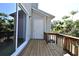Spacious wooden back deck with sliding glass door and exterior storage space at 615 Clemson Dr, Altamonte Springs, FL 32714