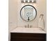 Modern bathroom featuring a sleek mirror, a white sink, and stylish fixtures at 615 Clemson Dr, Altamonte Springs, FL 32714