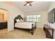 Spacious bedroom with a decorative bed frame, a large window, and access to the Primary bathroom at 615 Clemson Dr, Altamonte Springs, FL 32714
