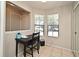 Cozy dining area with a functional desk and natural light through bright windows at 615 Clemson Dr, Altamonte Springs, FL 32714