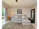 Comfortable living room features a plush rug, cozy sofa, and ample natural light at 615 Clemson Dr, Altamonte Springs, FL 32714