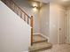 Carpeted staircase with wooden railing and white trim, providing a transition to the upper level at 615 Clemson Dr, Altamonte Springs, FL 32714