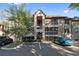 Apartment building exterior with a central stairwell entrance, balcony, and parking in front at 623 Dory Ln # 307, Altamonte Springs, FL 32714