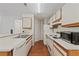 Well-lit kitchen with ample counter space, appliances, and wood-look flooring at 623 Dory Ln # 307, Altamonte Springs, FL 32714