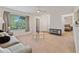 Cozy living room with natural light, ceiling fan, and a glimpse into another room at 623 Dory Ln # 307, Altamonte Springs, FL 32714