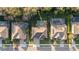 Overhead view of a neighborhood showcasing houses with pools and well-maintained yards at 645 American Holly Pl, Oviedo, FL 32765