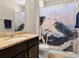 Bathroom with granite counter tops, a patterned shower curtain, and tile floors at 645 American Holly Pl, Oviedo, FL 32765
