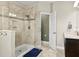 Bathroom featuring a tiled shower with glass door and open view to vanity area at 645 American Holly Pl, Oviedo, FL 32765