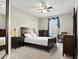 Bedroom with a ceiling fan, a full sized bed, and ample dresser storage at 645 American Holly Pl, Oviedo, FL 32765