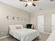 Bedroom featuring neutral walls, ceiling fan and a bed at 645 American Holly Pl, Oviedo, FL 32765