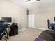 Comfortable bedroom space with neutral walls, ceiling fan, and desk ideal for work or study at 645 American Holly Pl, Oviedo, FL 32765