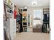 Spacious walk-in closet with custom shelving and drawers for optimal storage at 645 American Holly Pl, Oviedo, FL 32765