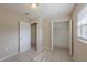 Bedroom featuring tile flooring, closet and an open window allowing natural light to enter at 73 Channing Ave, Orlando, FL 32811