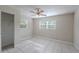 Bedroom with ceiling fan, closet, and plenty of natural light from the windows at 73 Channing Ave, Orlando, FL 32811