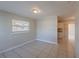 Neutral dining room featuring tile floors and a large window at 73 Channing Ave, Orlando, FL 32811
