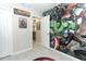 A room with a superhero theme, leading to the dining area at 7834 Turkey Oak Ln, Kissimmee, FL 34747