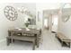 Dining room features modern chandelier, wooden bench seating, and an adjacent kitchen with stainless steel appliances at 7834 Turkey Oak Ln, Kissimmee, FL 34747