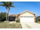 Charming single-Gathering home with a two-car garage, screened in lanai, and well-maintained lawn at 7834 Turkey Oak Ln, Kissimmee, FL 34747