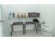 White storage space with wire shelving with essentials: luggage racks, steam iron, and more at 7834 Turkey Oak Ln, Kissimmee, FL 34747