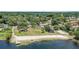 Aerial view of a community park area with beach access, boat dock, playground and beach volleyball at 801 Fox Valley Dr, Longwood, FL 32779