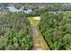 Aerial view of the community baseball and basketball courts surrounded by mature trees and a tranquil lake at 801 Fox Valley Dr, Longwood, FL 32779