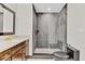 Sleek bathroom featuring a glass-enclosed shower, granite countertop, and modern fixtures at 801 Fox Valley Dr, Longwood, FL 32779