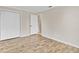 Bright bedroom features hardwood floors and closet at 801 Fox Valley Dr, Longwood, FL 32779