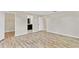 Spacious bedroom with wood-look flooring, neutral paint, and access to an en-suite bathroom and walk-in closet at 801 Fox Valley Dr, Longwood, FL 32779
