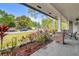Inviting front porch offers a serene view of the landscaped front yard and neighborhood at 801 Fox Valley Dr, Longwood, FL 32779