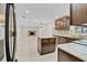 Open kitchen with wood cabinetry and an island flowing into the living area at 801 Fox Valley Dr, Longwood, FL 32779