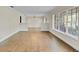 Spacious living area with bright windows and wood-look floors leading into adjacent rooms at 801 Fox Valley Dr, Longwood, FL 32779