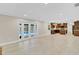 Spacious living area with backyard pool view and adjacent kitchen with tile flooring at 801 Fox Valley Dr, Longwood, FL 32779