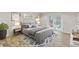 Stylishly furnished main bedroom with French doors leading to the backyard at 801 Fox Valley Dr, Longwood, FL 32779