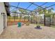 Outdoor brick patio with fire pit and partial enclosure at 801 Fox Valley Dr, Longwood, FL 32779