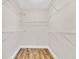 Empty walk-in closet with ample shelving and wood-style flooring at 801 Fox Valley Dr, Longwood, FL 32779