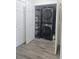 Closet with stacked Samsung washer and dryer and shelving at 8775 Sartori St # 302, Orlando, FL 32829