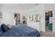 A bedroom features neutral tones, modern décor, and access to a bathroom and walk-in closet at 944 Flyer St, Orange City, FL 32763