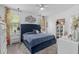Bright bedroom with a tufted headboard, soft lighting, and decorative accents creating a cozy space at 944 Flyer St, Orange City, FL 32763