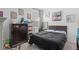 Cozy bedroom with neutral walls, decorative art and a plush, comfortable bed at 944 Flyer St, Orange City, FL 32763
